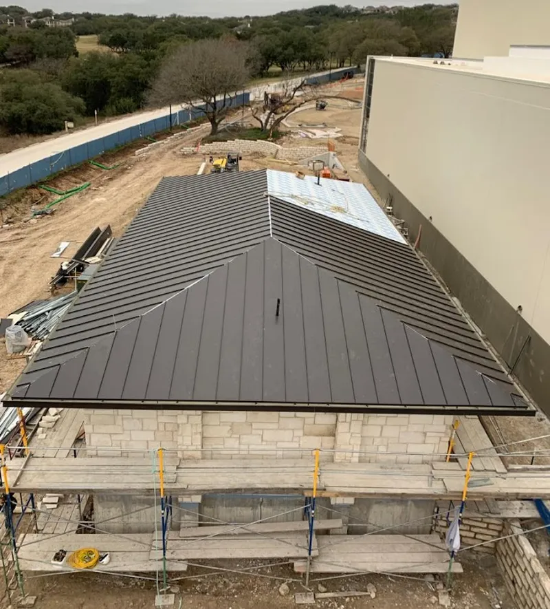 Metal roof new construction with scaffolding in Florence